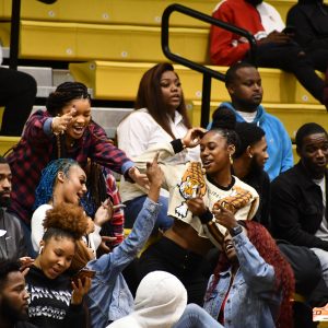 Group of students in stadium attending campus orientation