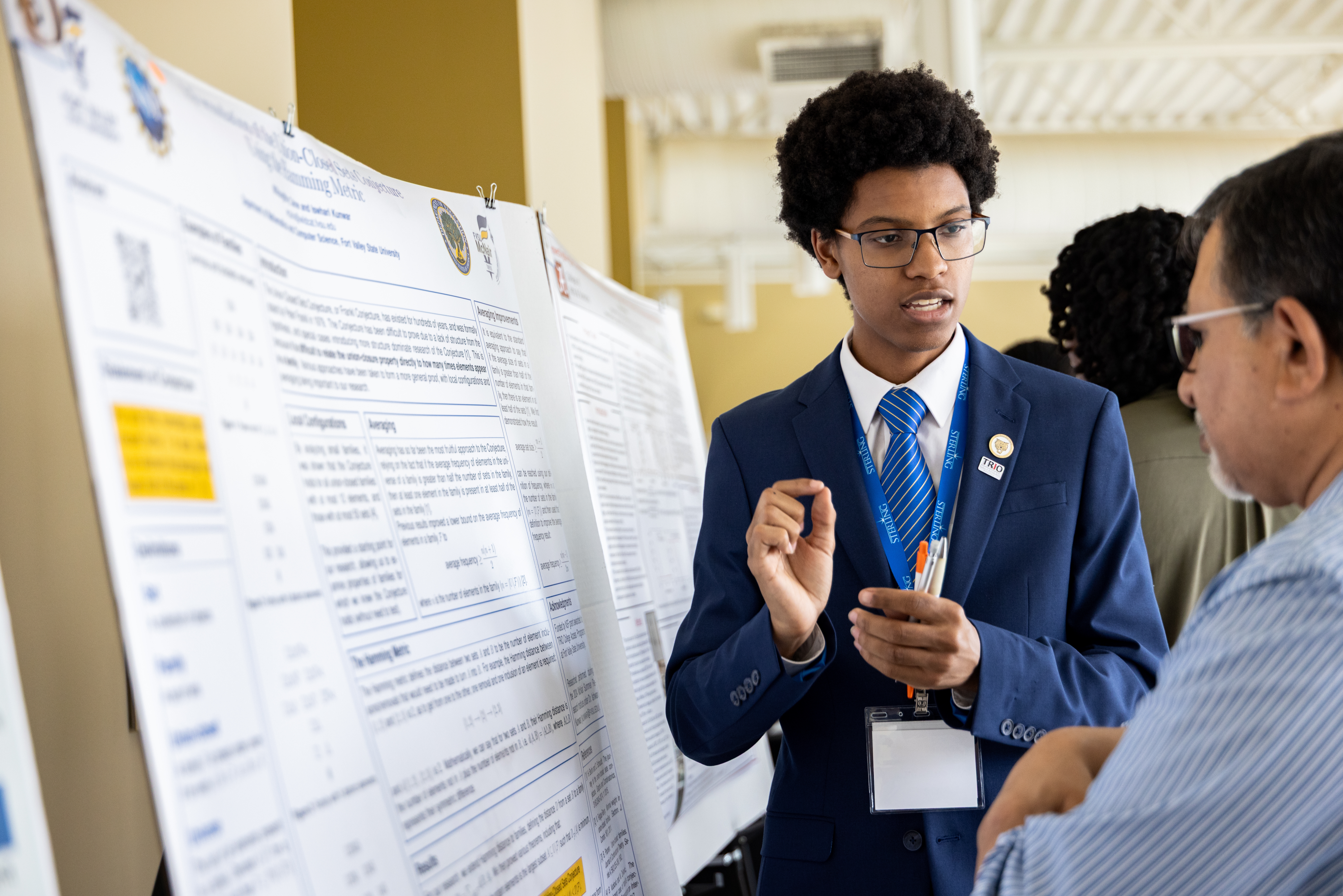 Young man explaining mathematic concept