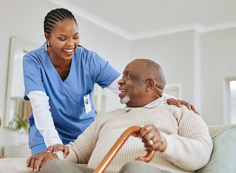 Nurse smiling at older patient